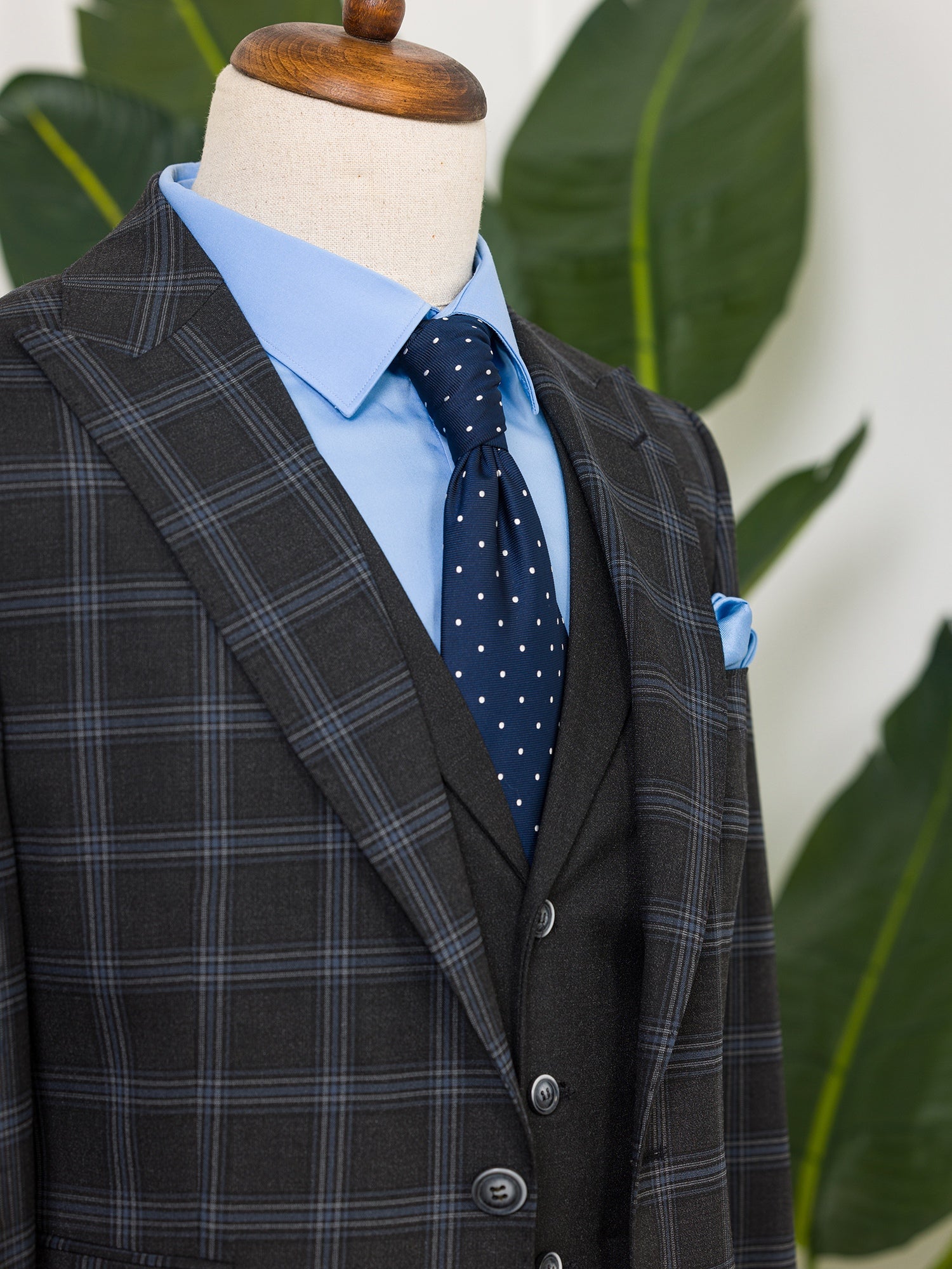 Men’s navy plaid slim-fit 3-piece suit with peak lapel blazer, matching vest and trousers, styled for business and formal occasions with a modern tailored fit.