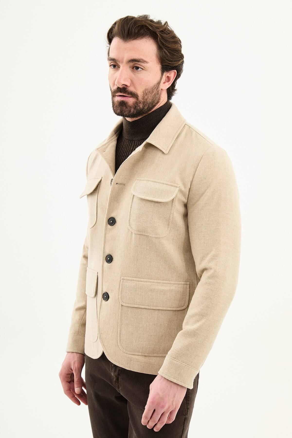 Men’s beige wool blend utility jacket with button-up front and four pockets, regular fit smart casual layering jacket styled with brown trousers and dark turtleneck sweater