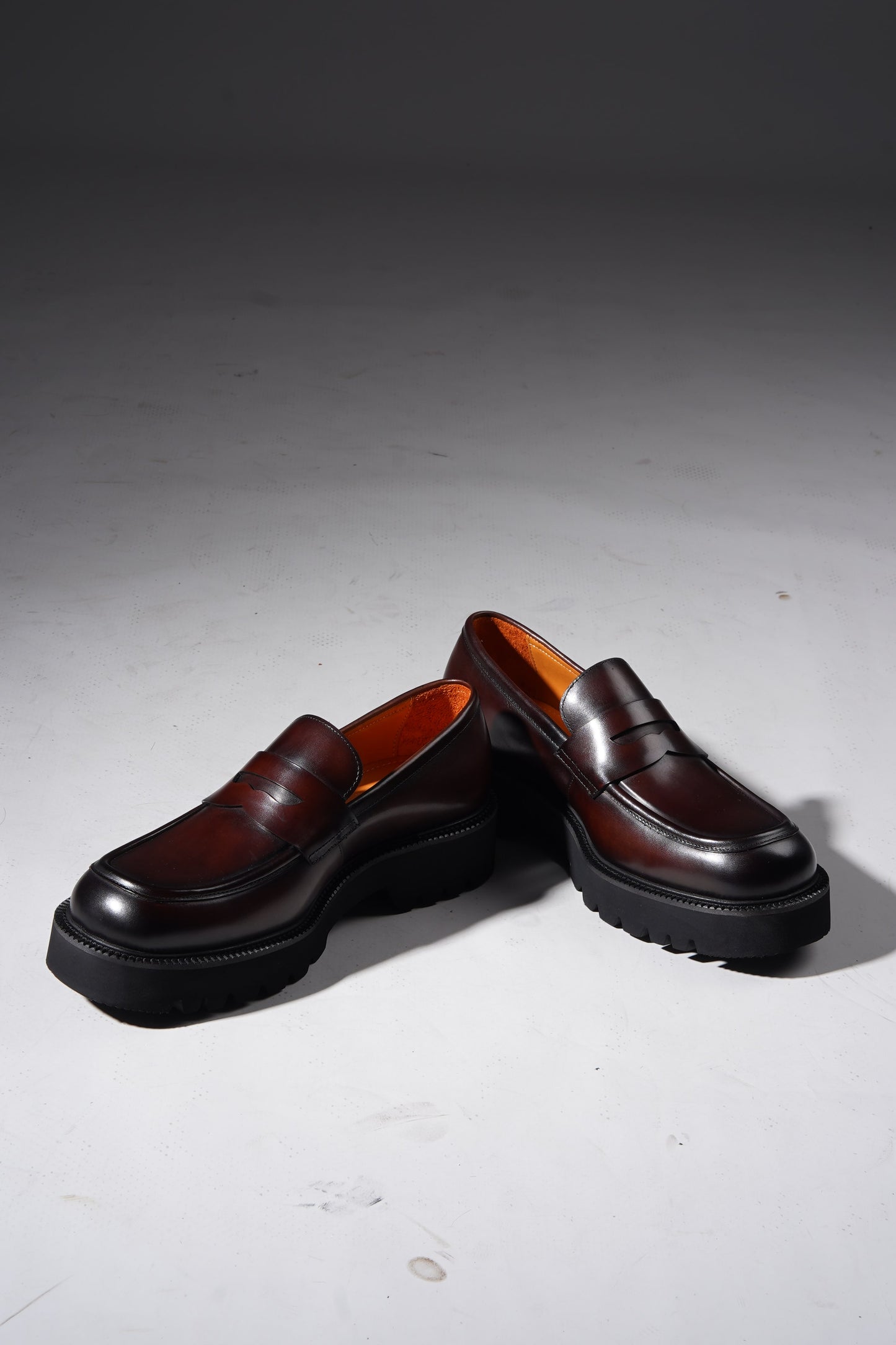 Pair of brown leather penny loafers with EVA sole