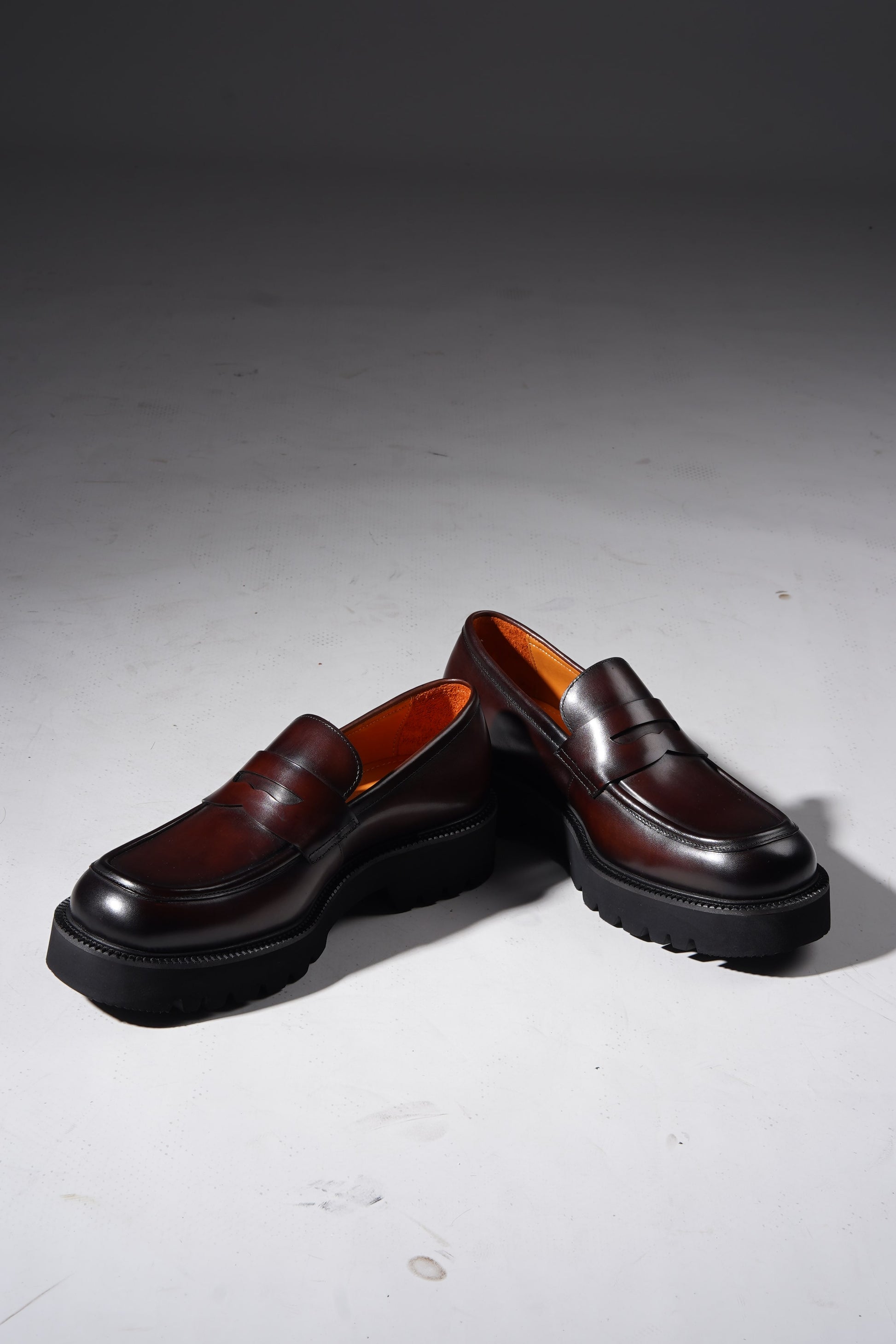 Pair of brown leather penny loafers with EVA sole