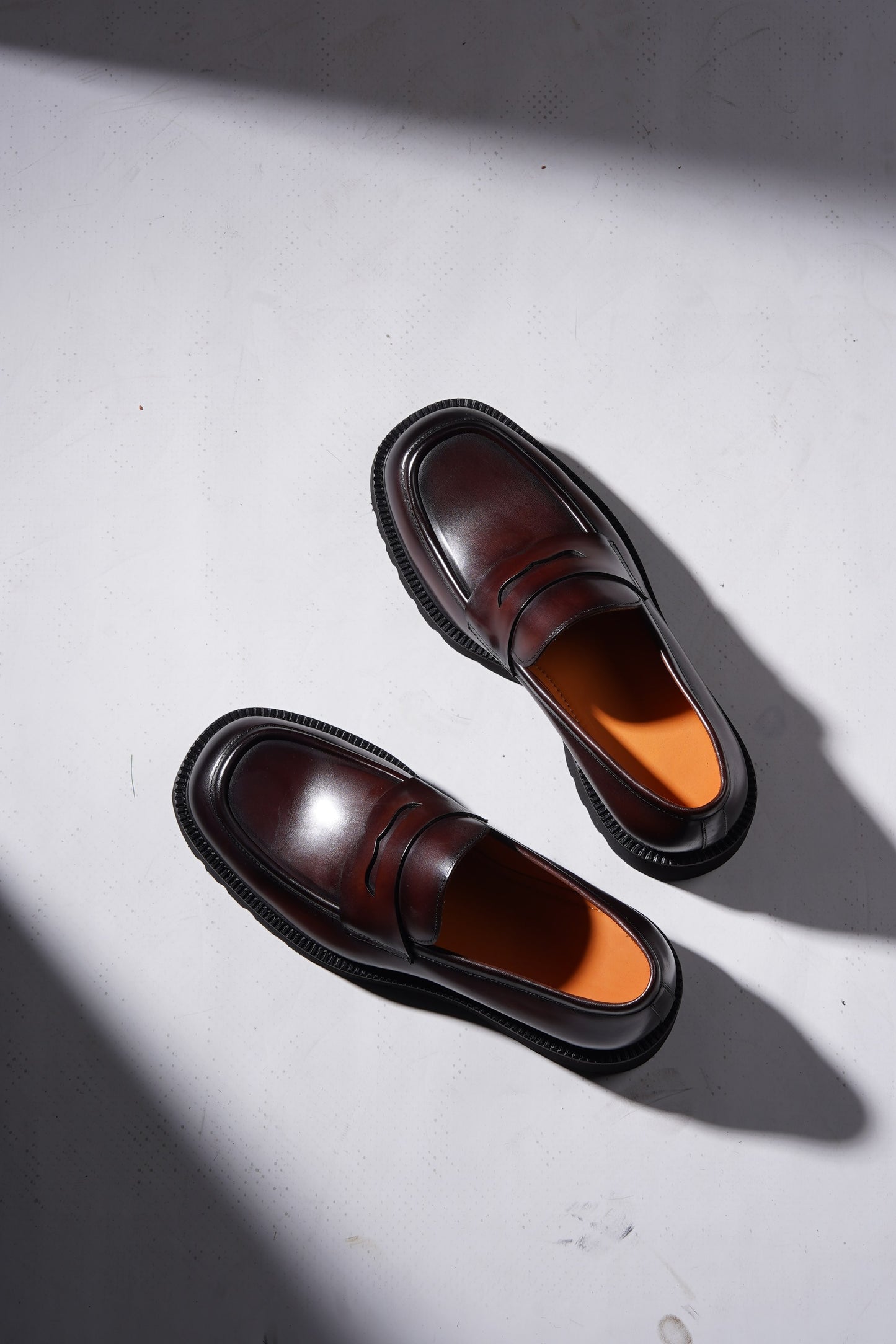Pair of brown leather penny loafers with EVA sole