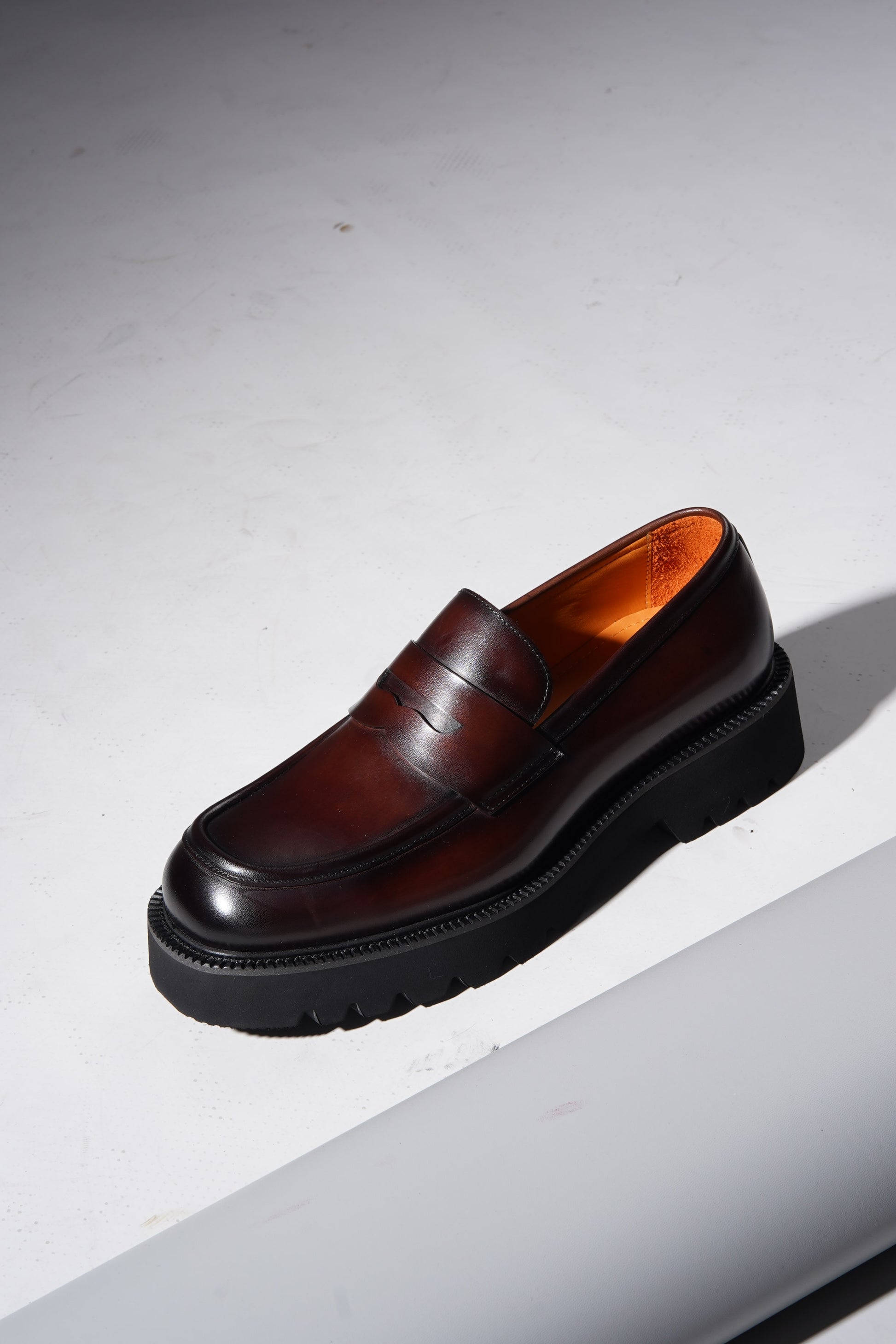 Pair of brown leather penny loafers with EVA sole