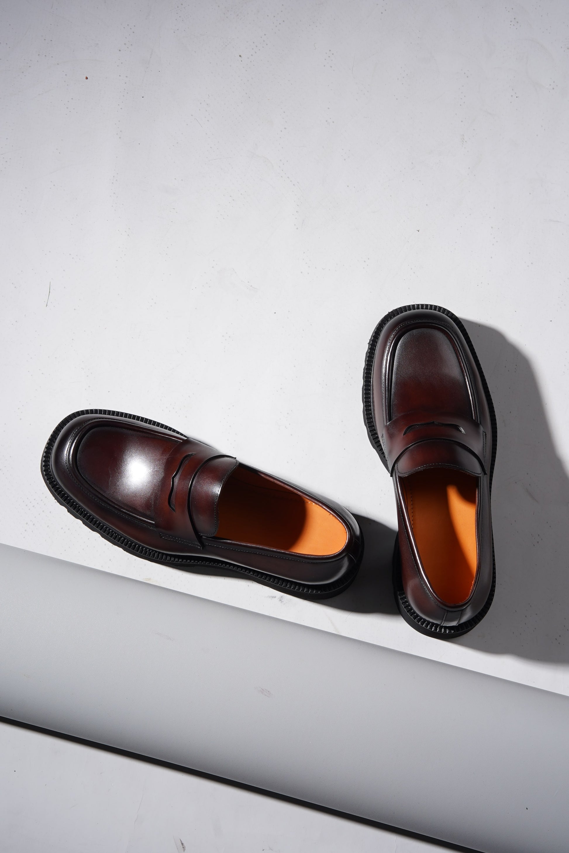 Pair of brown leather penny loafers with EVA sole