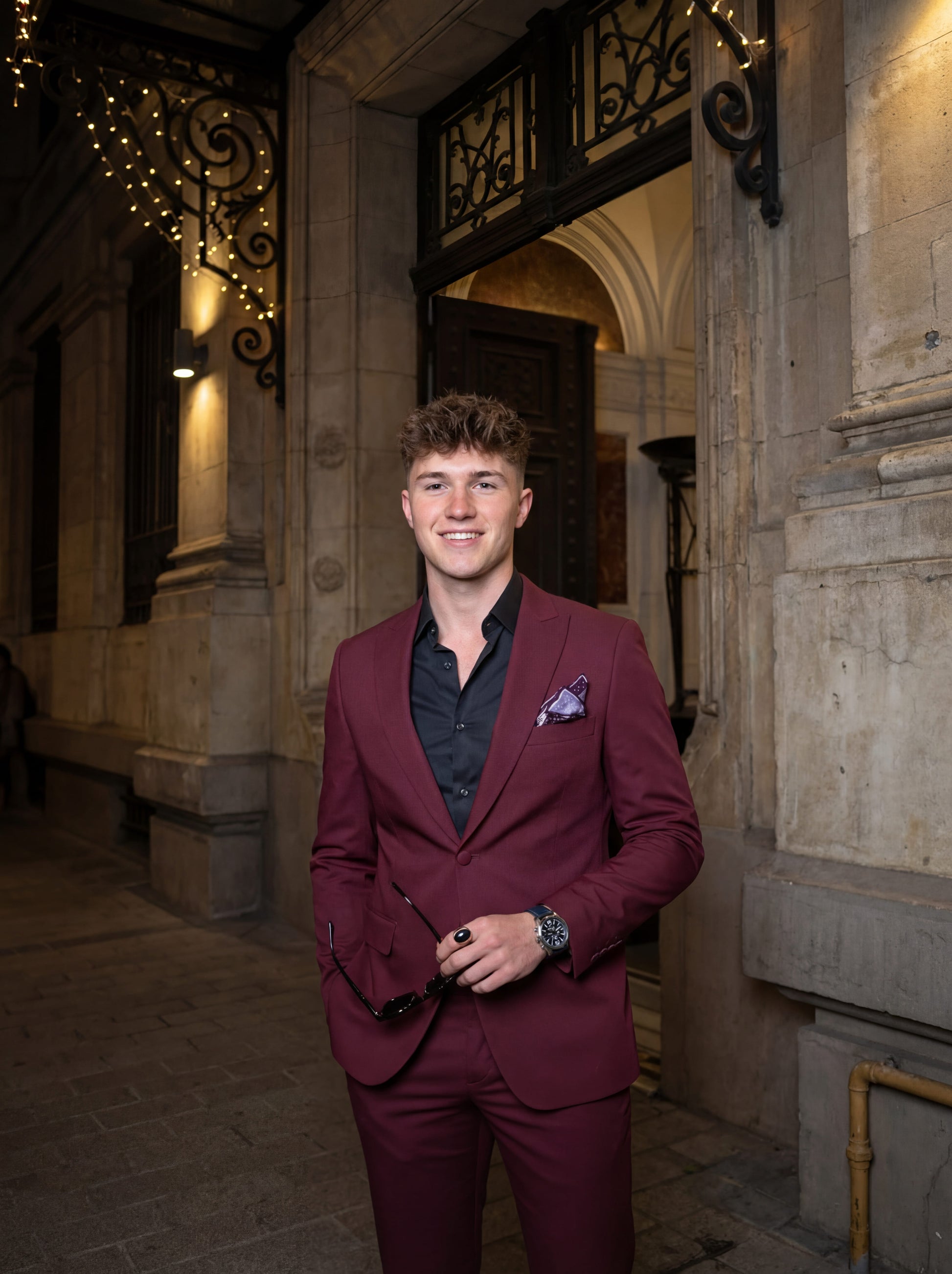 Burgundy slim fit prom tuxedo styled for formal evening event