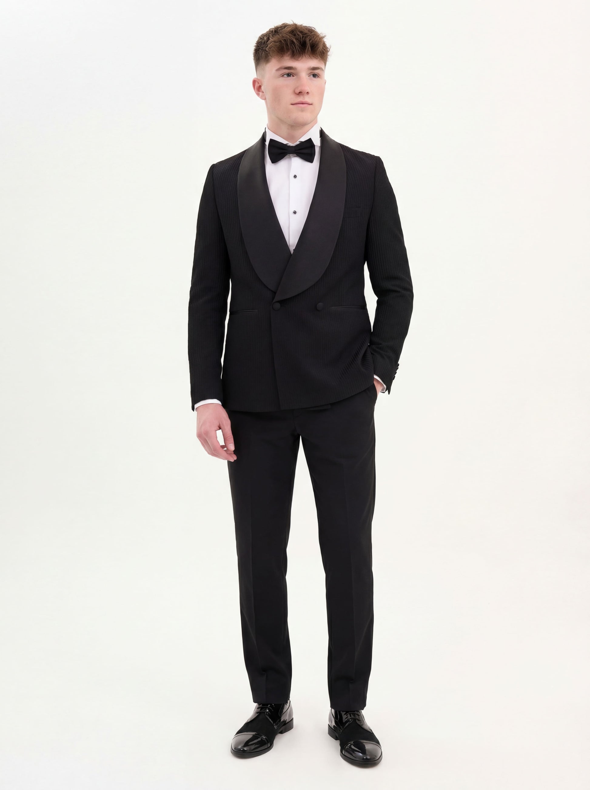 Black prom tuxedo styled with bow tie and tailored trousers for prom night