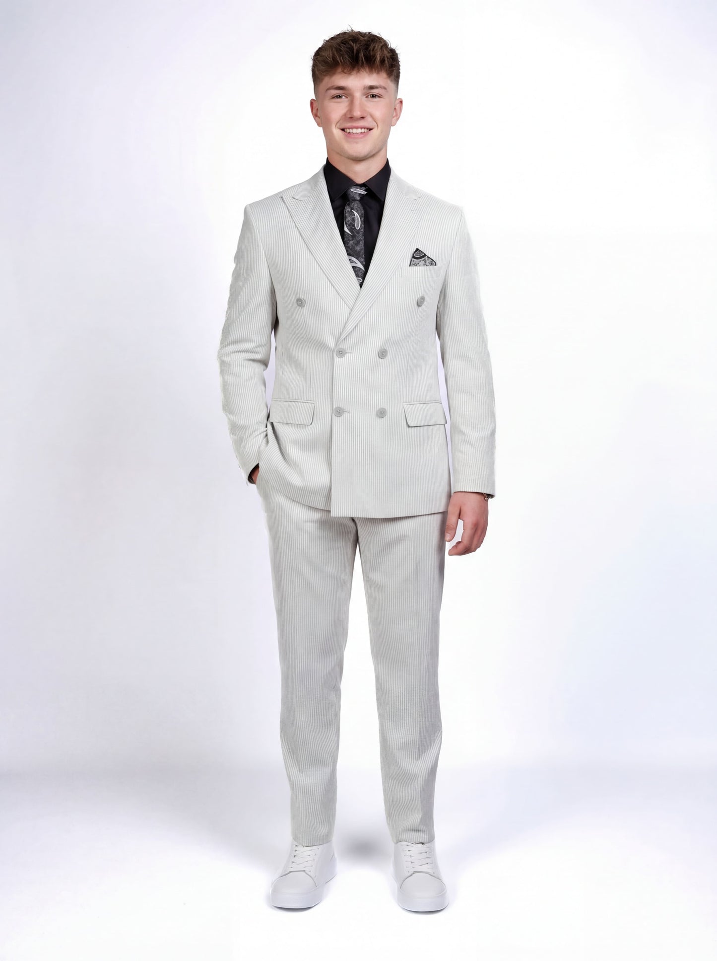 Gray double-breasted pinstripe prom suit worn by young male model at formal event