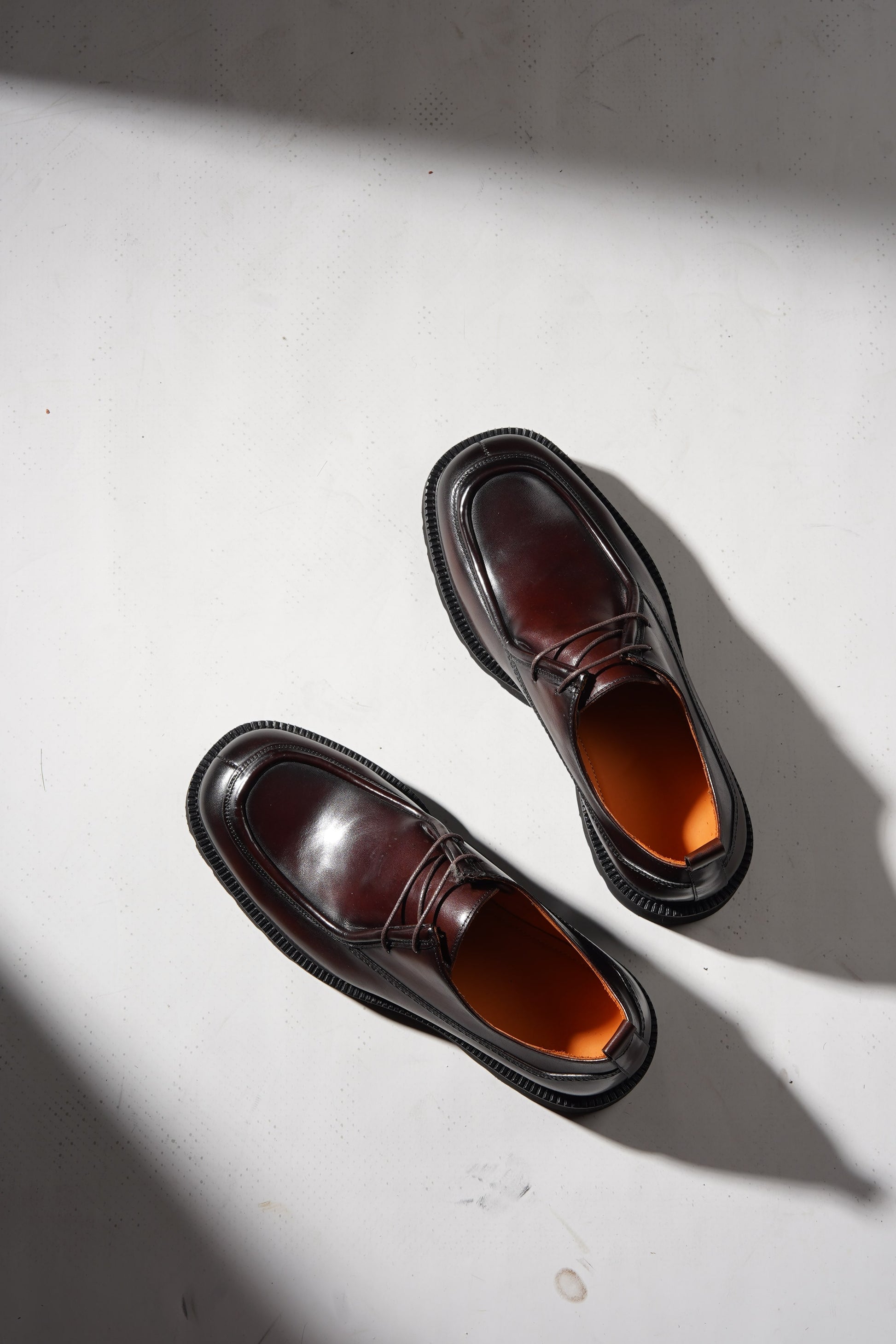 Angled pair view of Bordeaux Split-Toe Derby Shoes highlighting craftsmanship and Bordeaux hue.