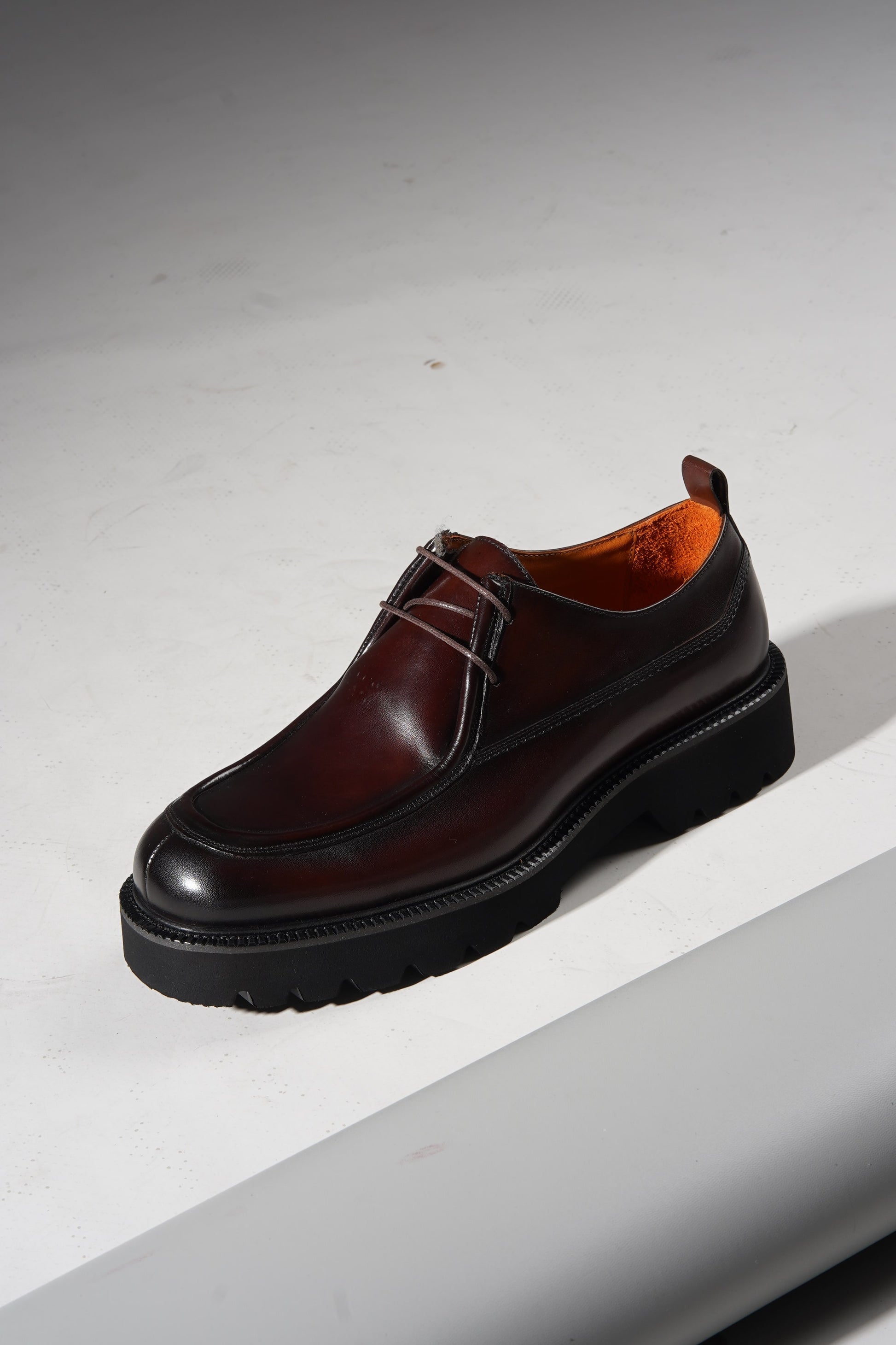 Angled pair view of Bordeaux Split-Toe Derby Shoes highlighting craftsmanship and Bordeaux hue.