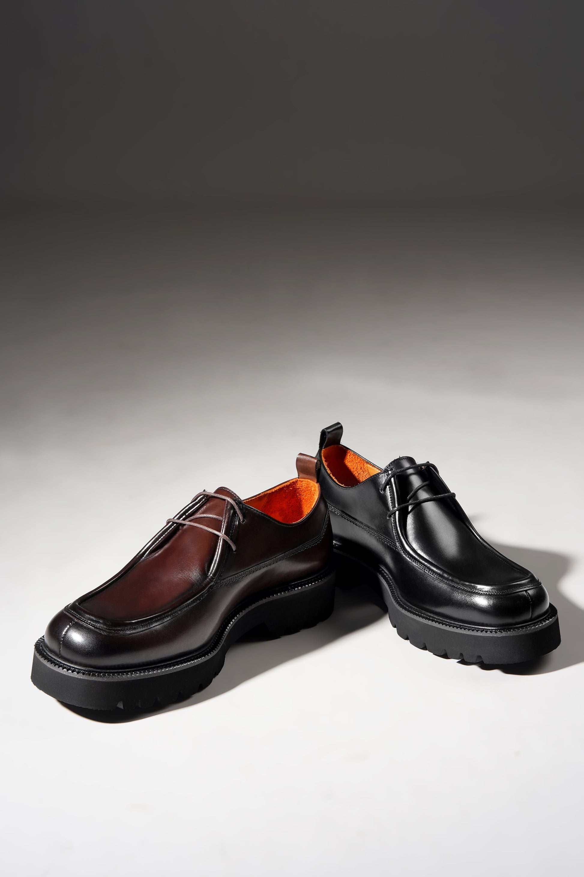 Angled pair view of Bordeaux Split-Toe Derby Shoes highlighting craftsmanship and Bordeaux hue.