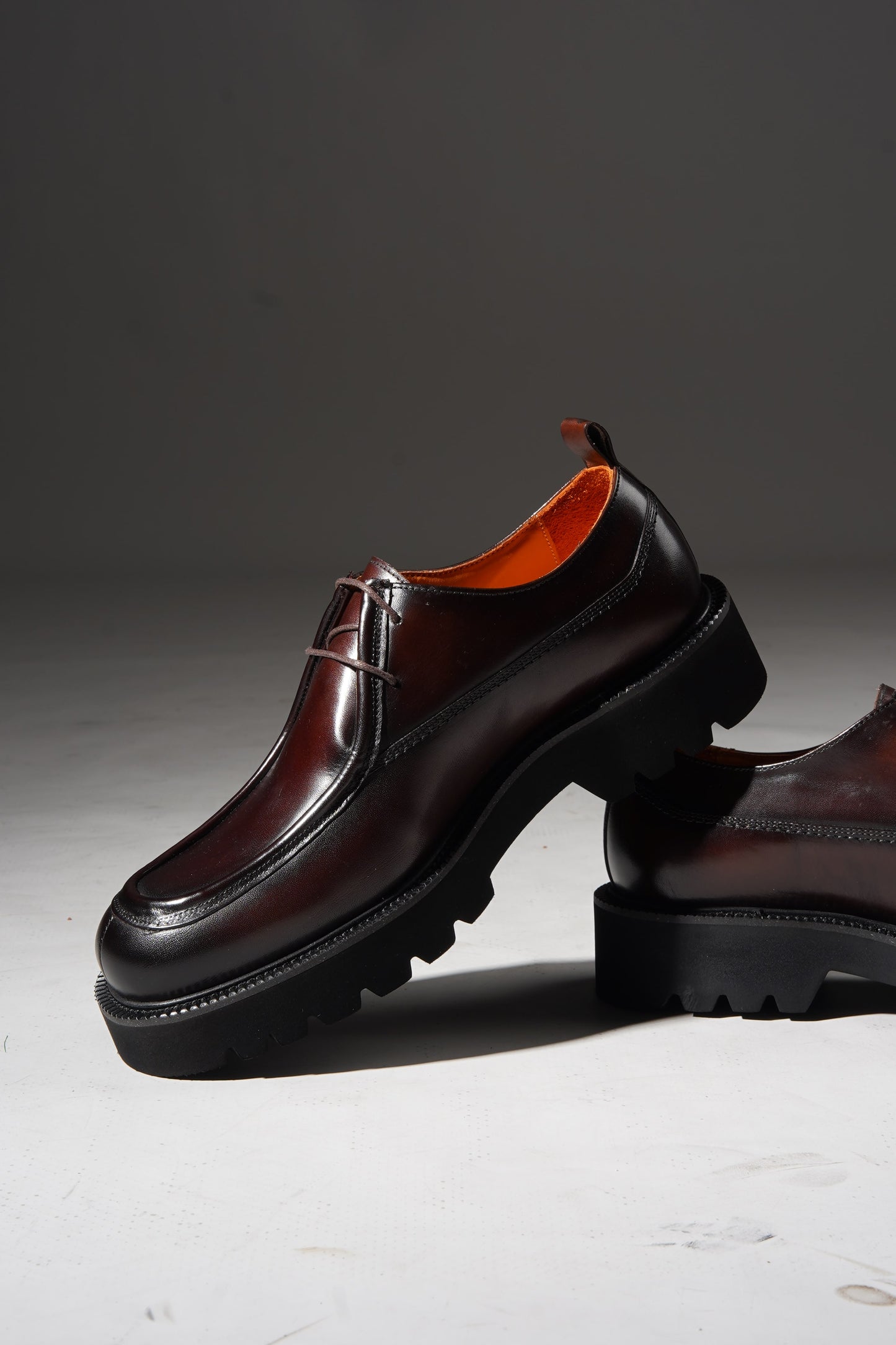Angled pair view of Bordeaux Split-Toe Derby Shoes highlighting craftsmanship and Bordeaux hue.