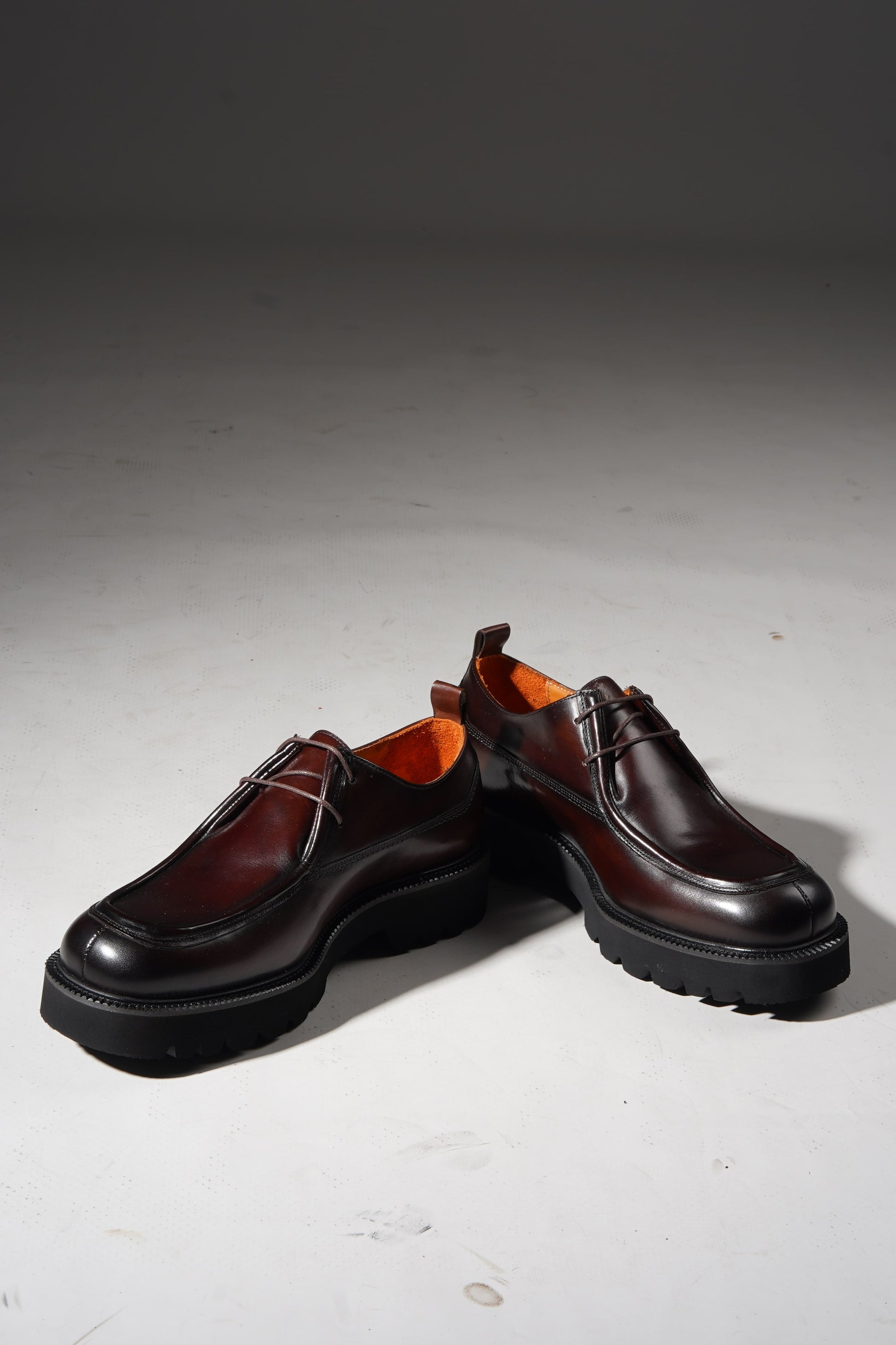 Angled pair view of Bordeaux Split-Toe Derby Shoes highlighting craftsmanship and Bordeaux hue.