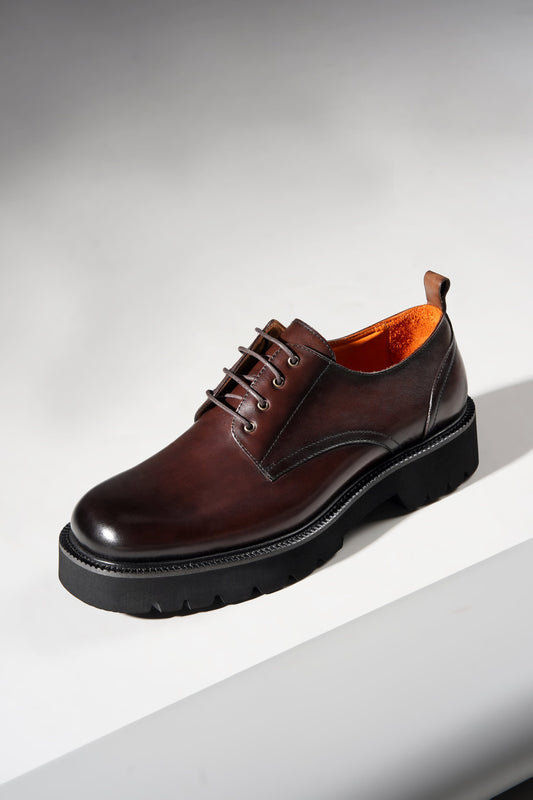 pair of brown derby shoes showcasing premium leather upper and chunky EVA outsole.
