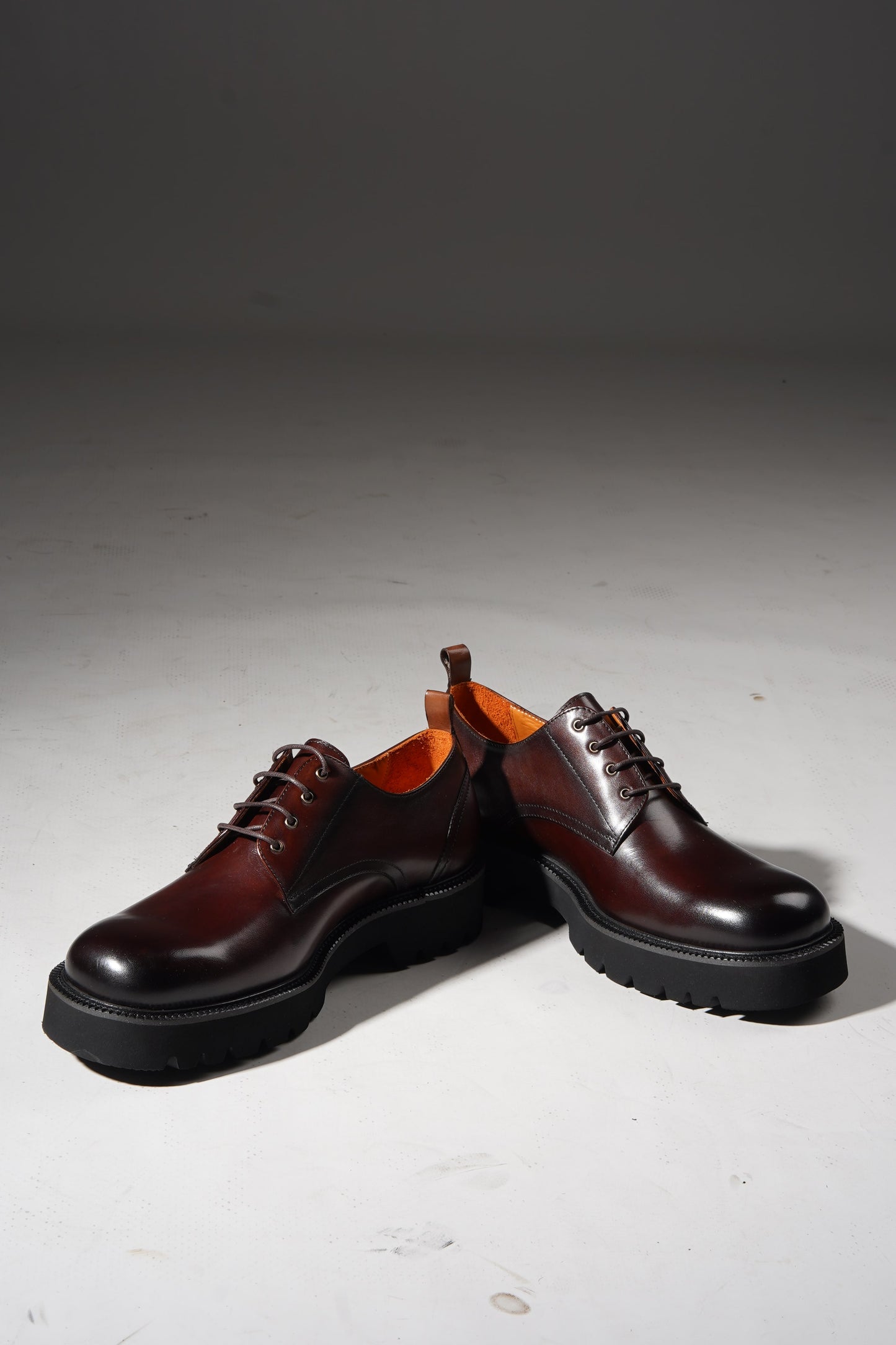 pair of brown derby shoes showcasing premium leather upper and chunky EVA outsole.