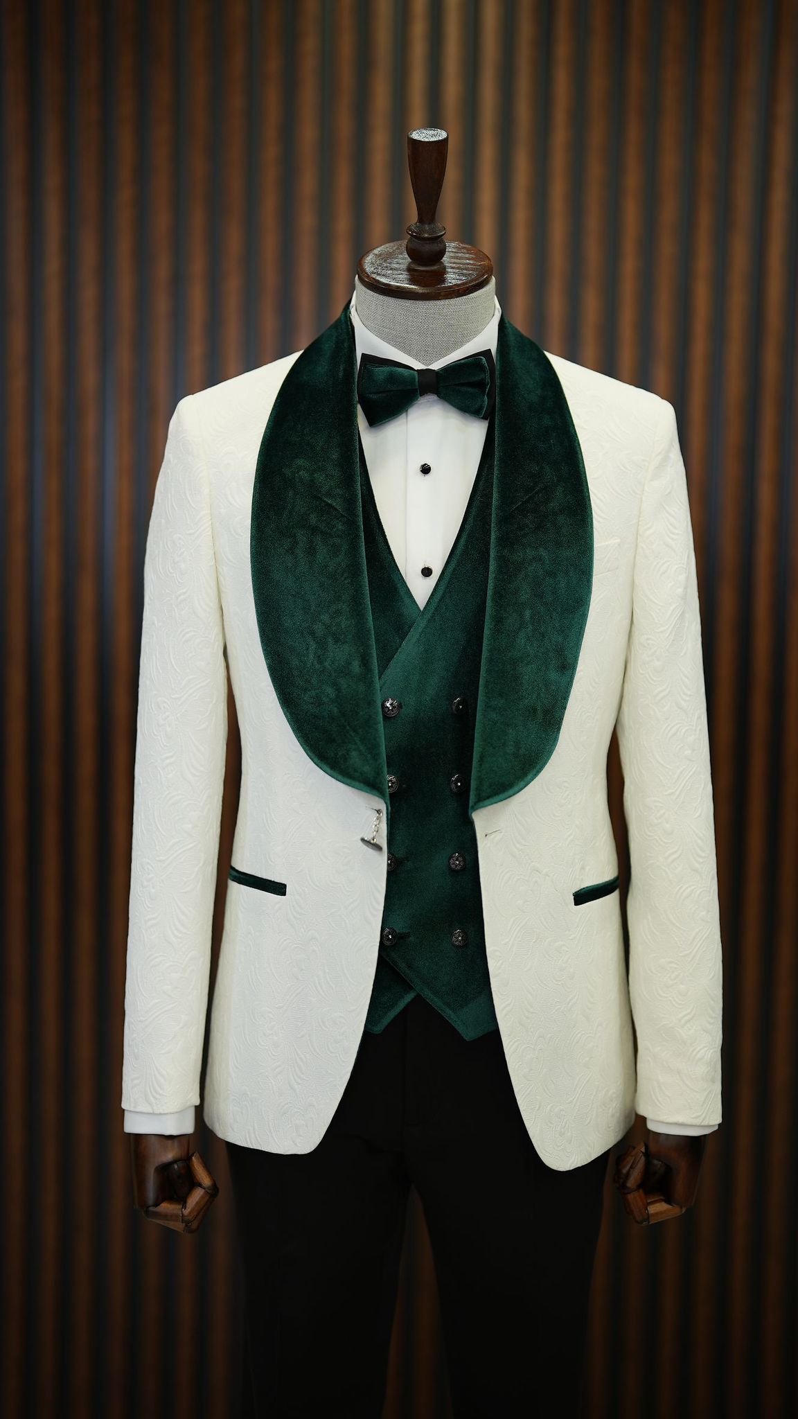 A Green and White Tuxedo Suit on display.