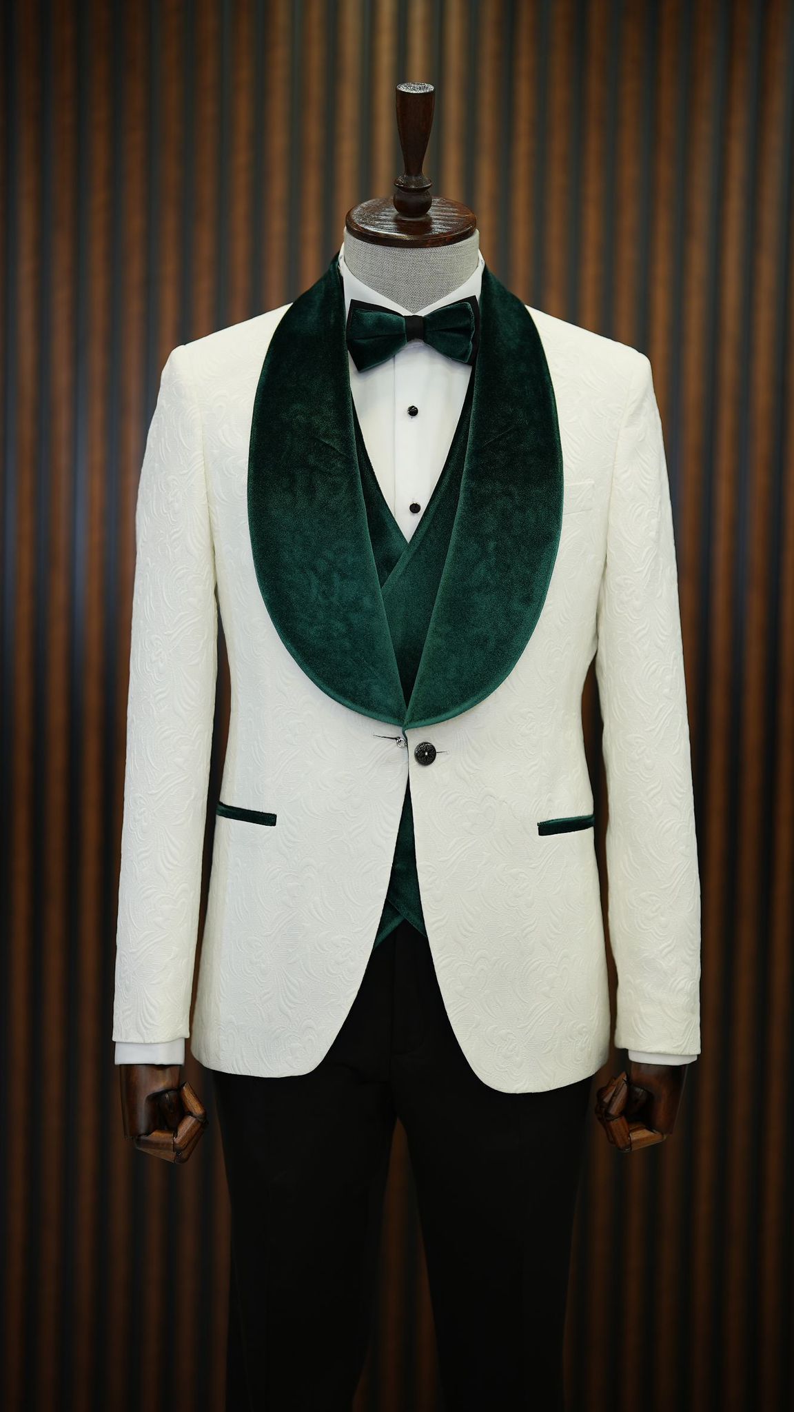 A  Green and White Tuxedo Suit on display.