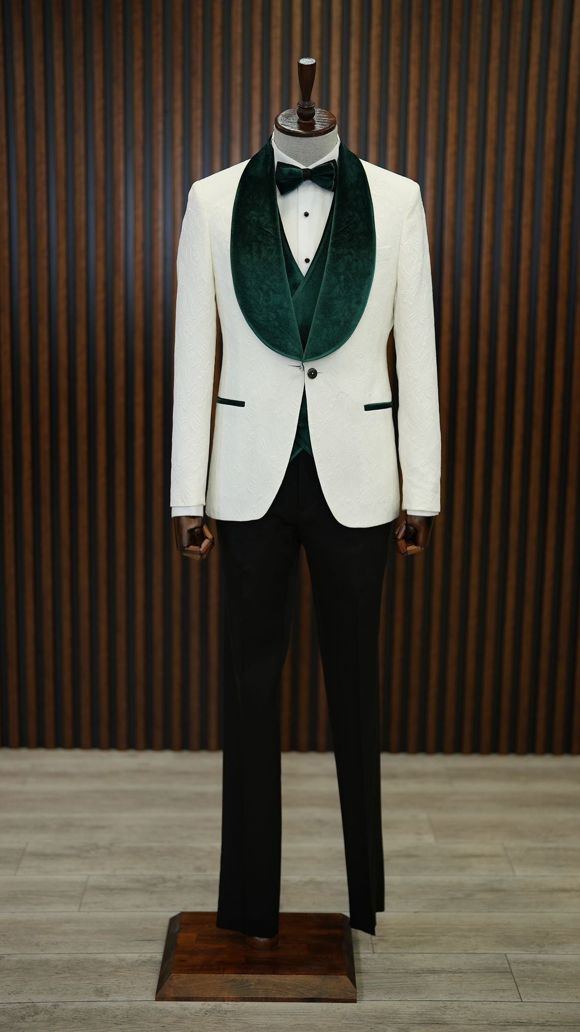A Green and White Tuxedo Suit on display.