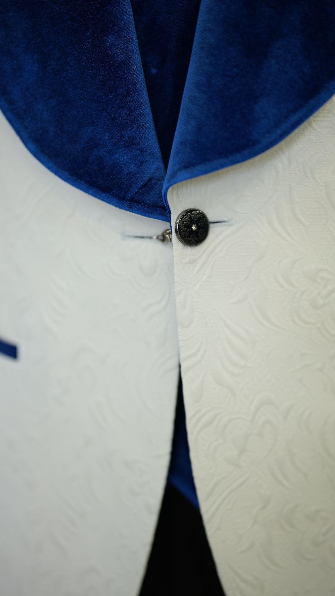 A Blue and White Tuxedo Suit on display.