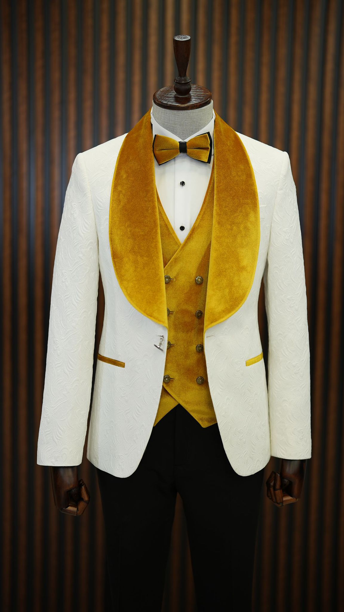 A Yellow and White Tuxedo Suit on display.
