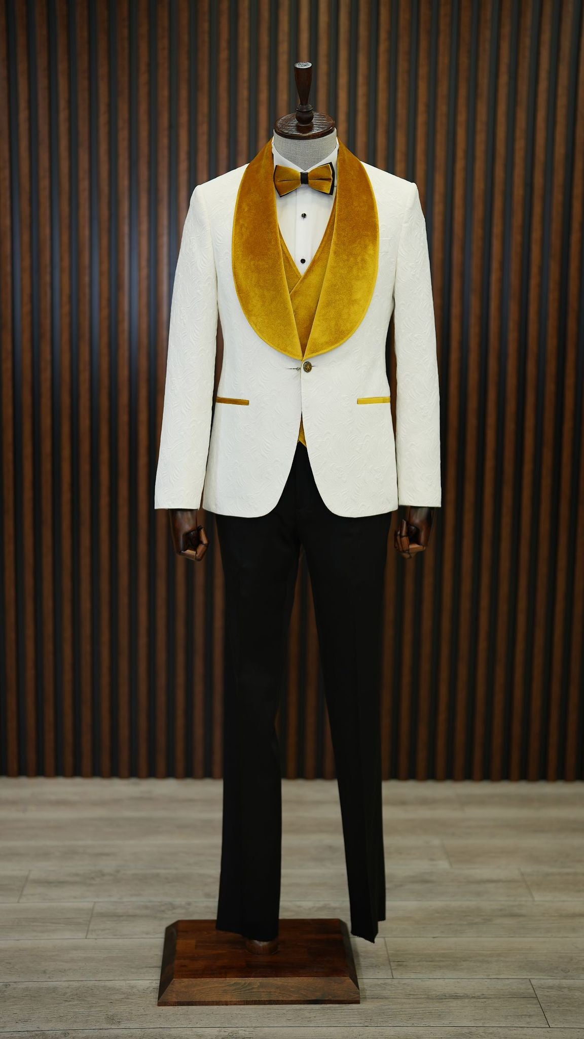 A Yellow and White Tuxedo Suit on display.