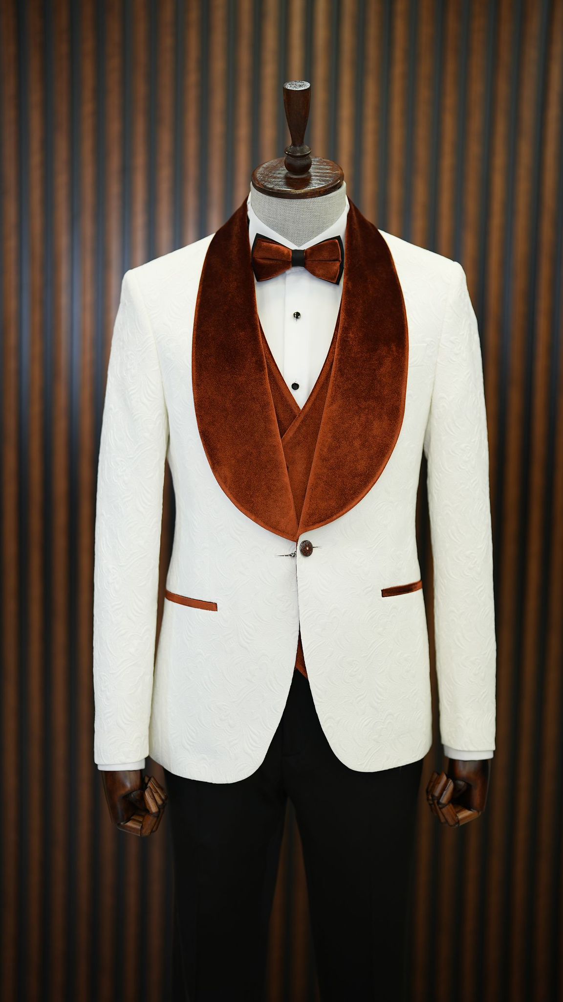 A Brown and White Tuxedo Suit  on display.