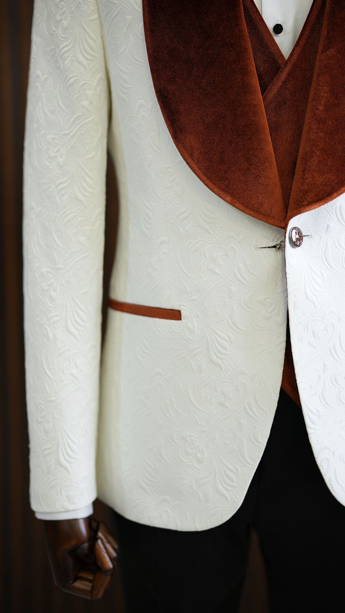 A Brown and White Tuxedo Suit on display.