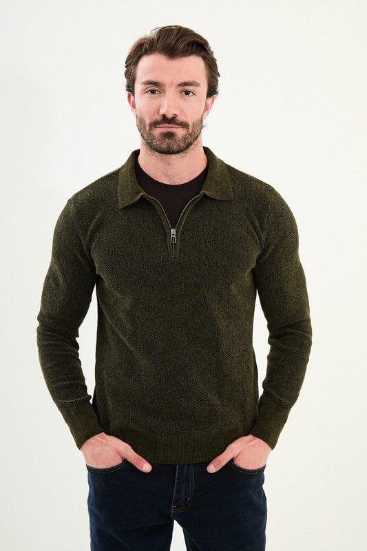 A man wearing a khaki slim fit knitwear sweater with a zip-up collar and subtle textured pattern, paired with dark jeans.