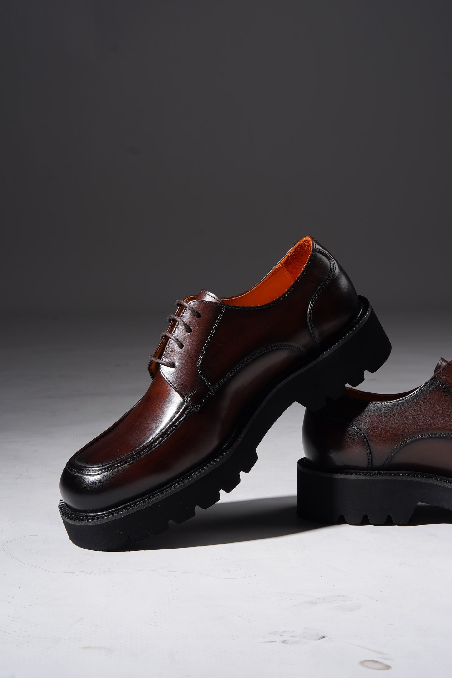 Pair of Luxury Brown Chunky Derby Shoes showing rugged sole and elegant hand-polished finish.