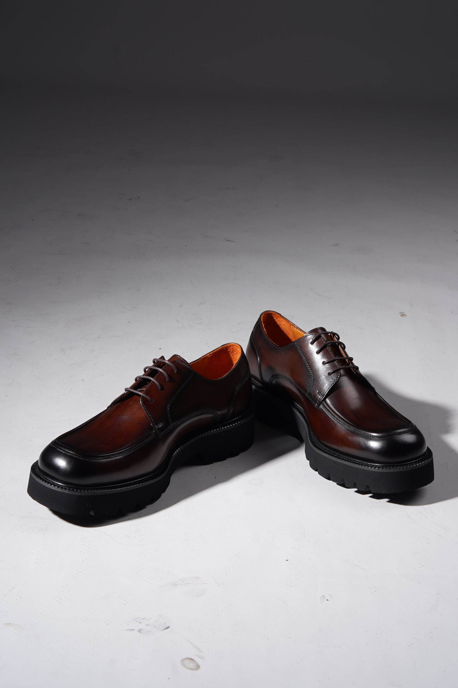 Pair of Luxury Brown Chunky Derby Shoes showing rugged sole and elegant hand-polished finish.