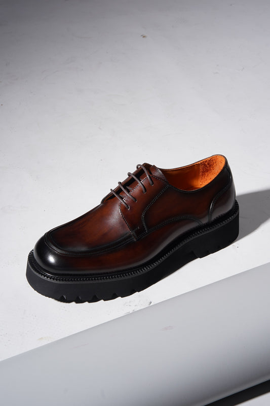 Pair of Luxury Brown Chunky Derby Shoes showing rugged sole and elegant hand-polished finish.
