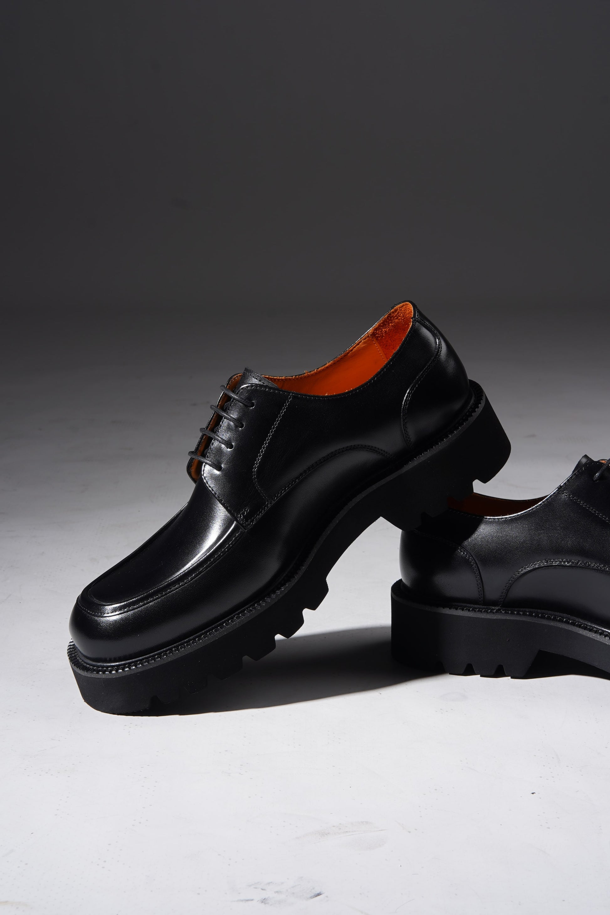 Pair of Luxury Chunky Derby Shoes angled to highlight chunky sole and polished leather upper.
