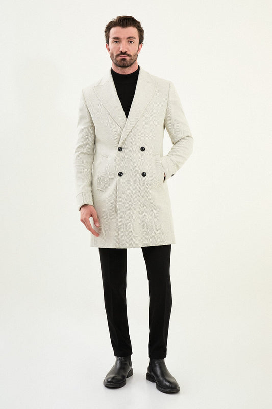 Slim fit ecru winter coat styled with a black turtleneck and leather shoes.