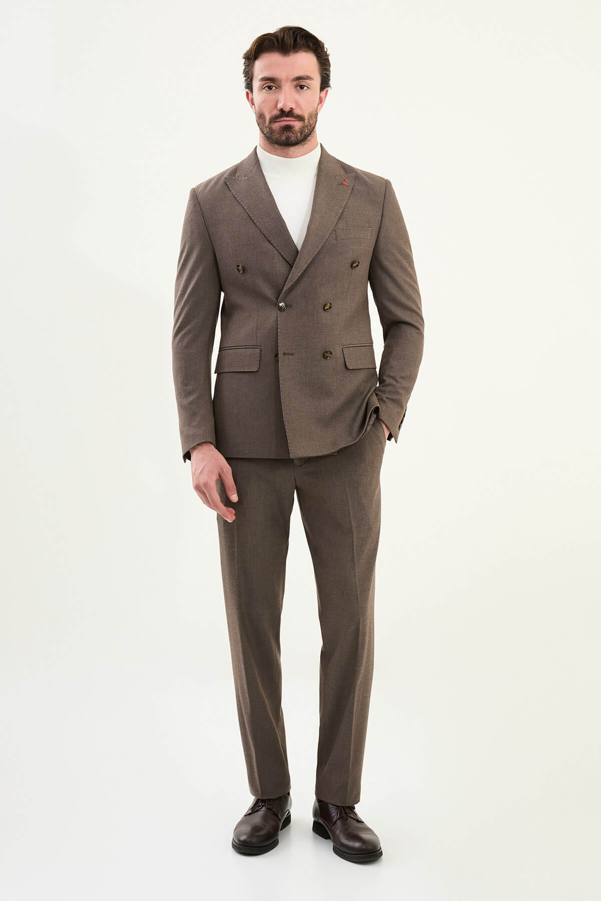 Men’s coffee brown mélange slim-fit double-breasted wool-blend suit with peak lapels, tortoiseshell buttons, and red origami lapel pin.