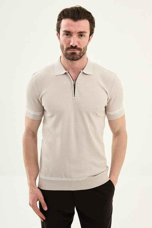 Man wearing a beige slim-fit quarter-zip polo T-shirt, short sleeves, styled for summer casual wear, standing against a neutral background.