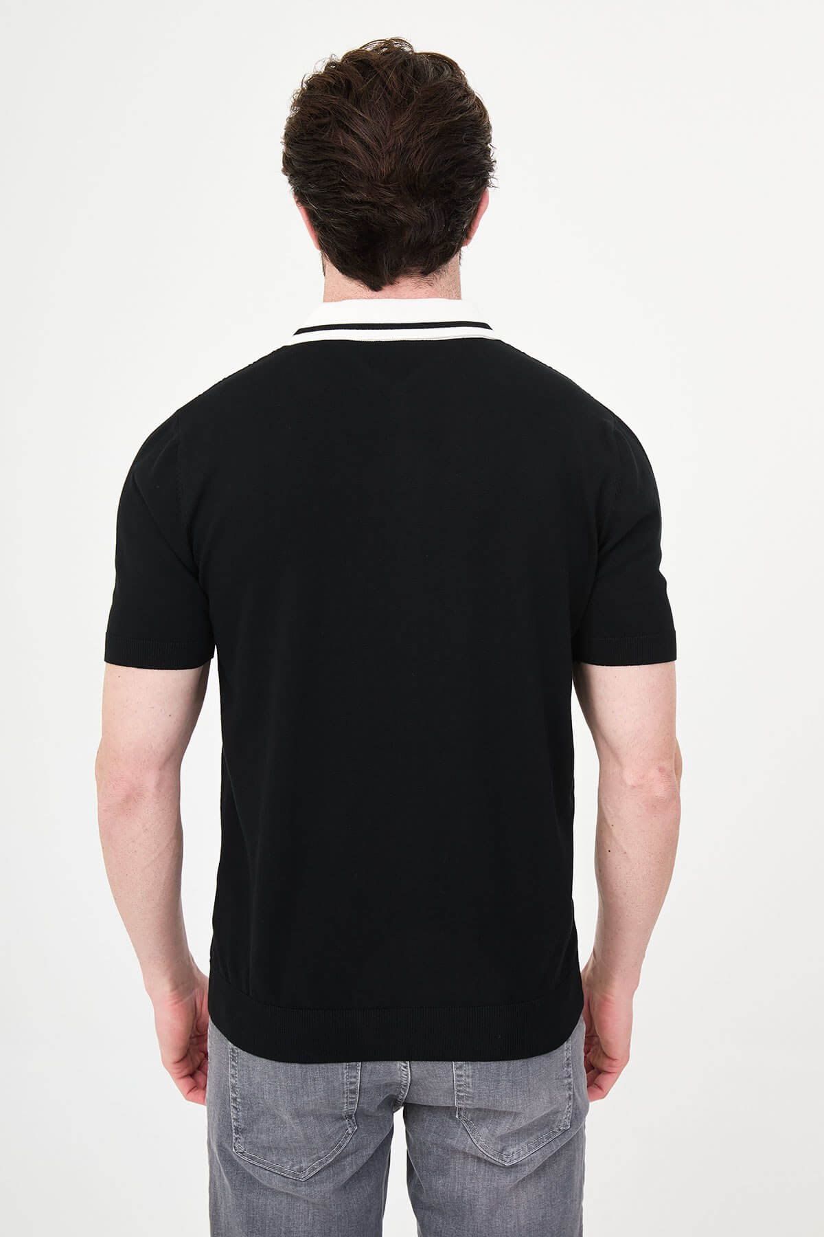 Men’s black short sleeve knit polo shirt with button front, contrast collar, textured breathable fabric, slim fit smart casual style
