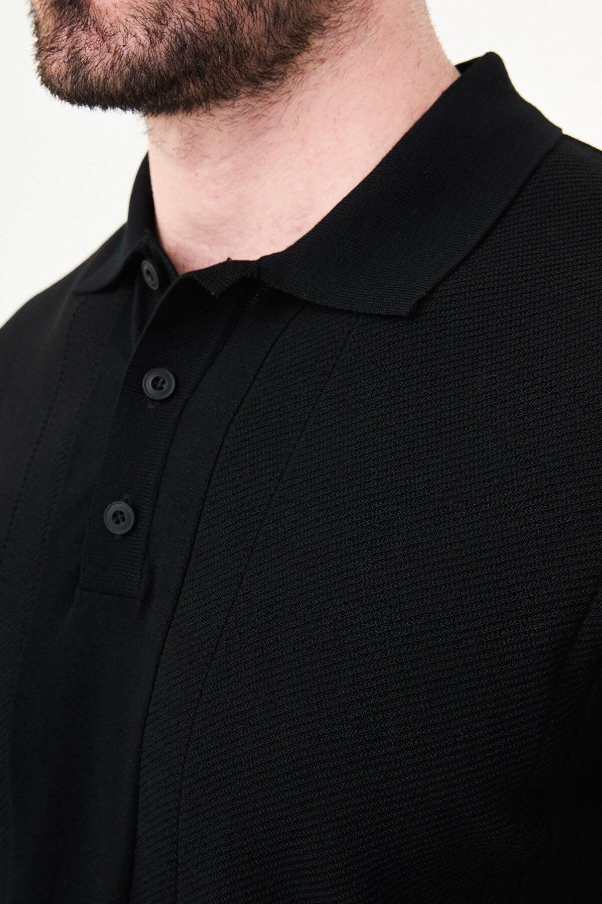 Men’s black slim fit textured knit polo T-shirt with vertical pattern, short sleeves, classic collar, modern minimal style