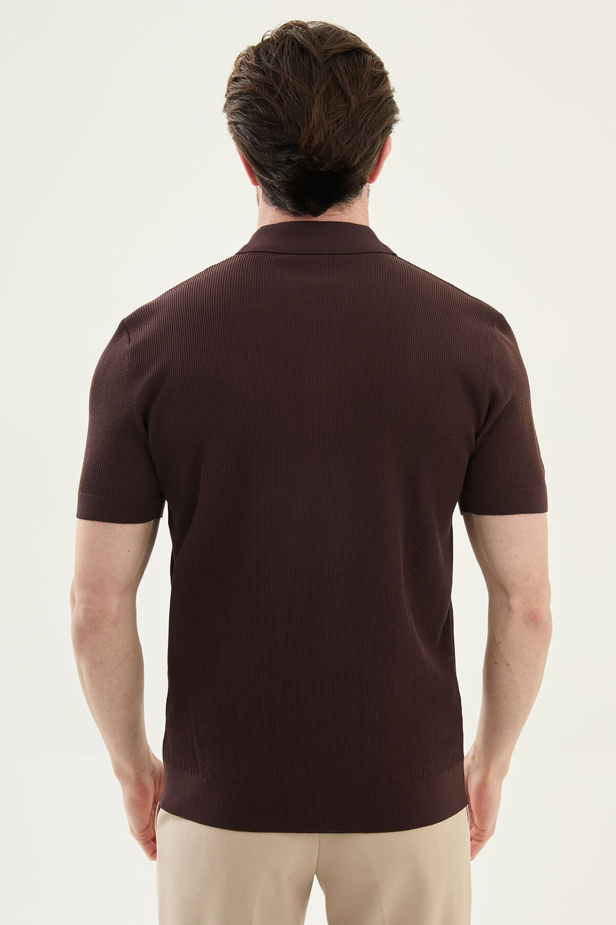 Men’s brown slim-fit knit polo shirt with classic collar, short sleeves, and textured knit finish for summer smart-casual style.
