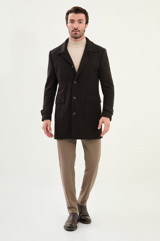 brown slim fit peacoat styled with beige turtleneck, brown trousers, and brown Chelsea boots.