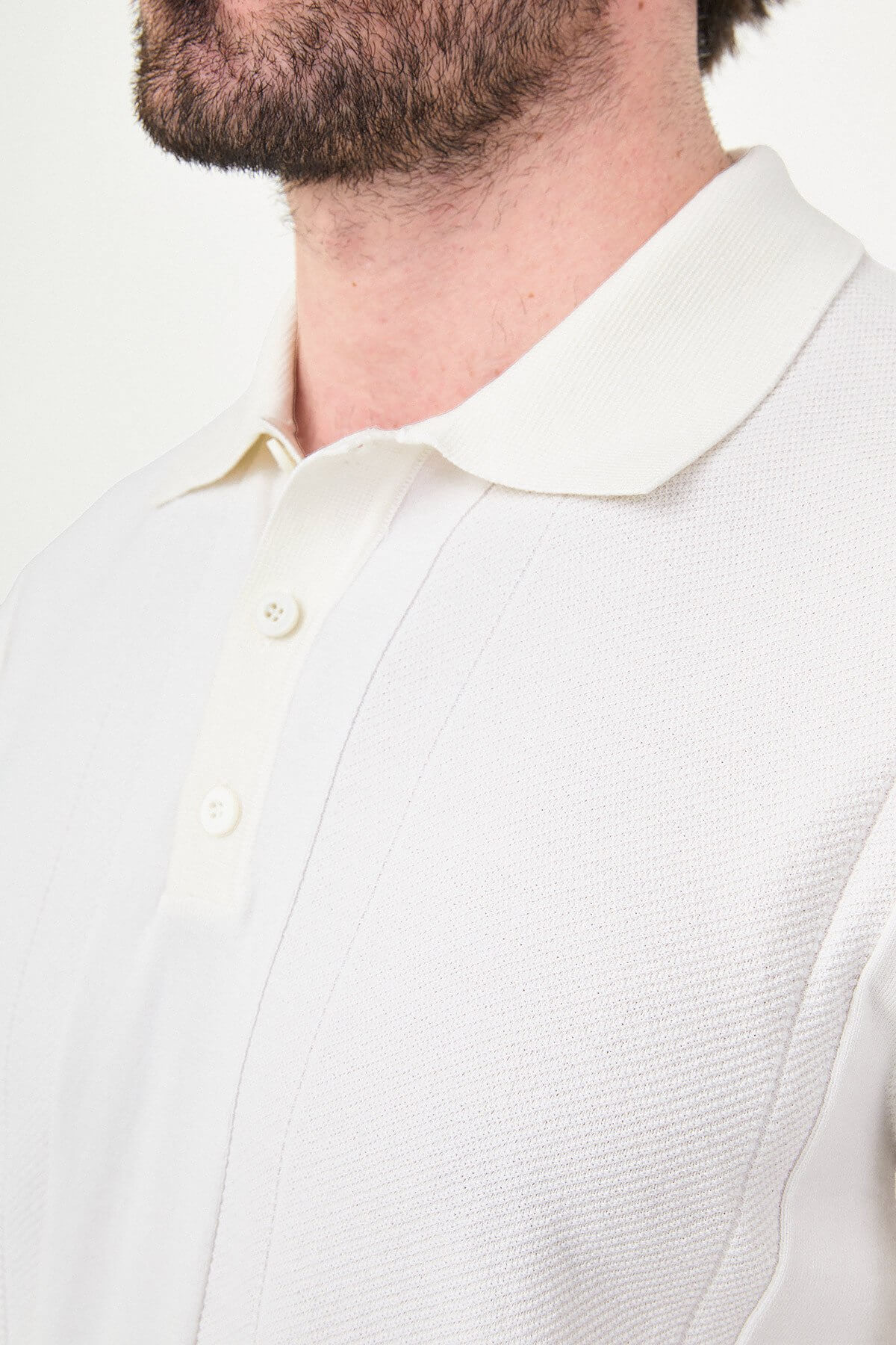 Men’s ecru slim fit textured knit polo T-shirt with vertical panel design, short sleeves, classic collar, minimal modern style