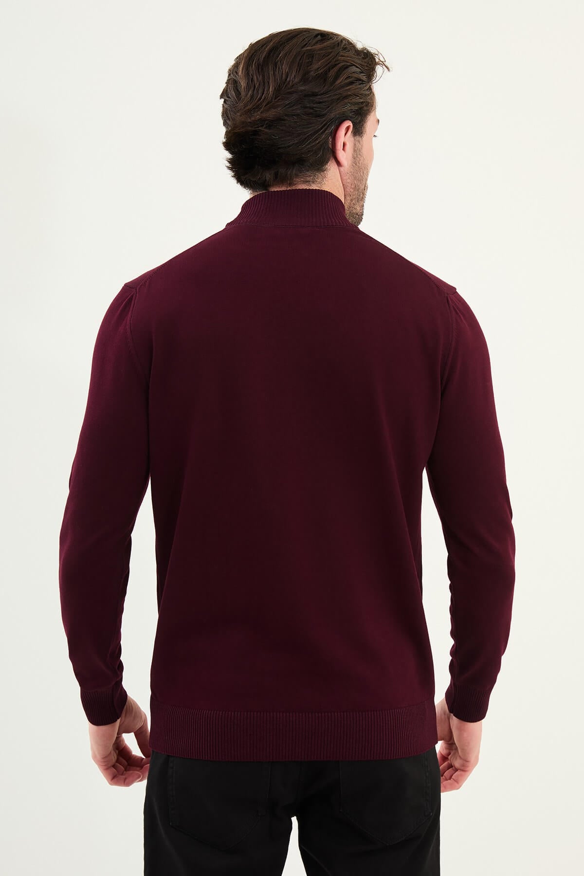 Man wearing a burgundy slim fit half-turtleneck knitwear sweater from the Fall-Winter collection.