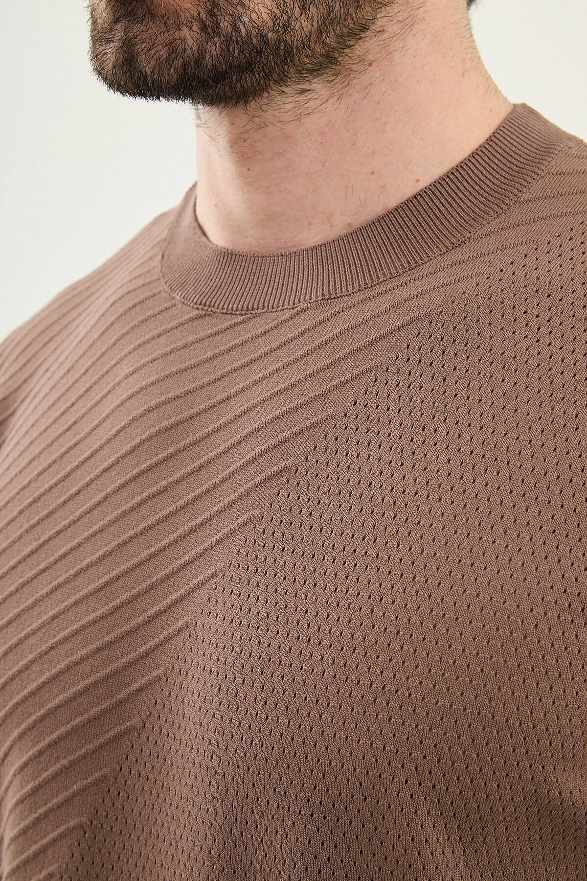 Light brown diagonal knit texture t-shirt fabric detail close-up