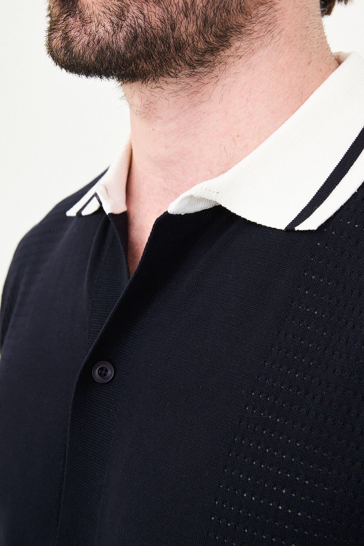 Men’s navy blue short sleeve knit polo shirt with button front, contrast tipped collar, textured side panels, slim fit smart casual style
