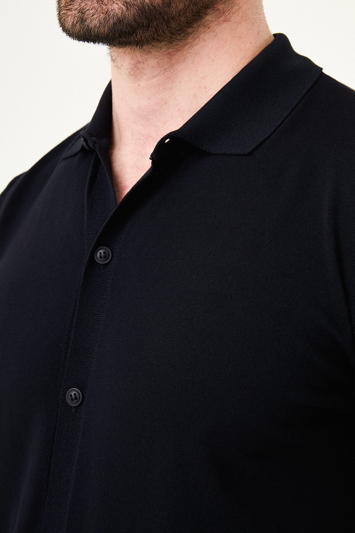 Men’s navy blue slim fit short sleeve knitwear shirt with button-up front, soft viscose fabric, modern versatile style