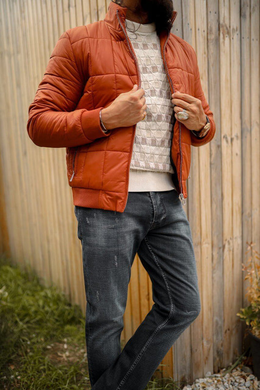 A men’s slim-fit tile zipper pocket detailed jacket paired with a patterned sweater and dark jeans, styled for a modern casual look.