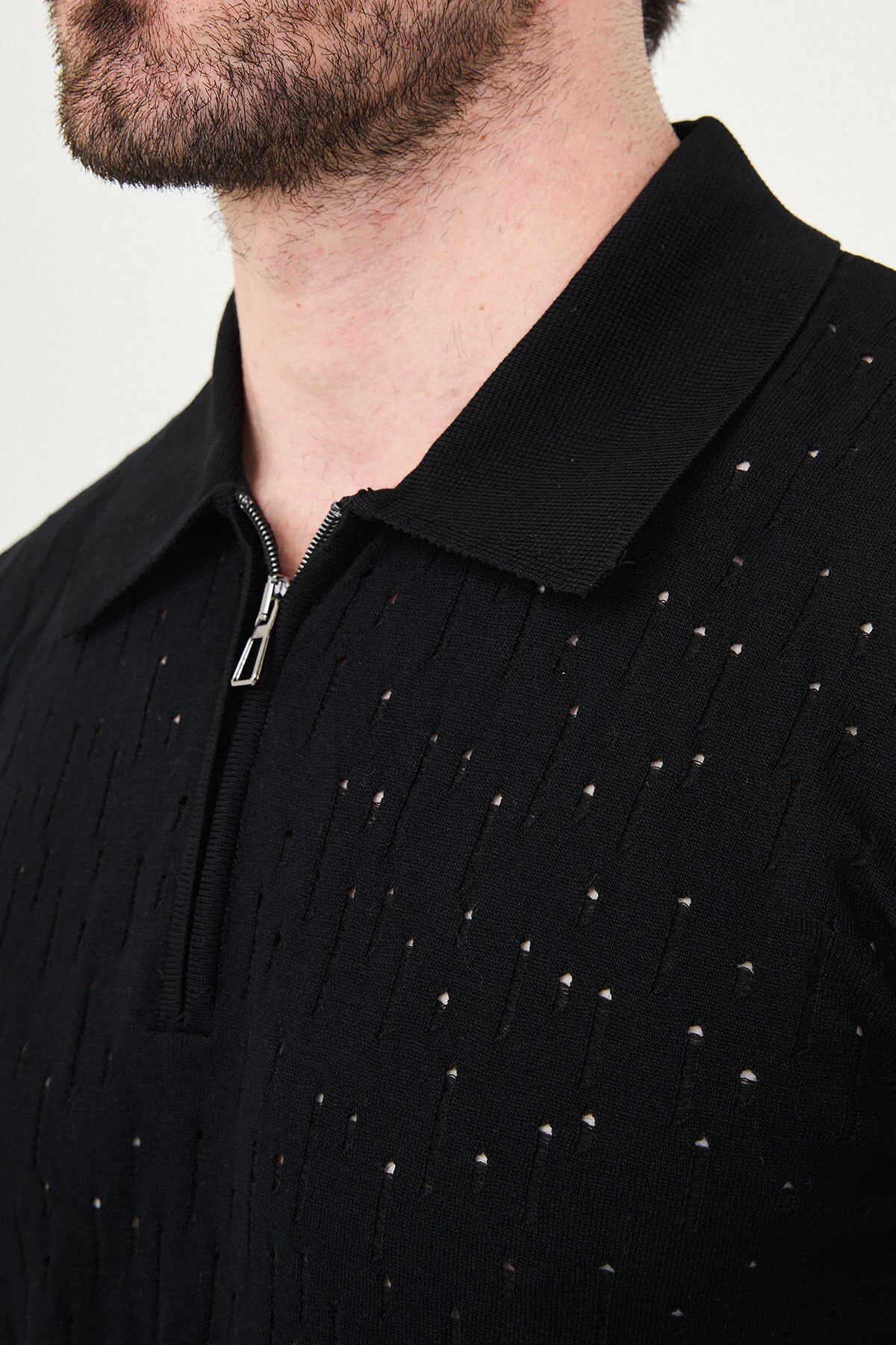 Men’s black slim fit zippered polo knit t-shirt with perforated texture, short sleeves, modern smart casual style