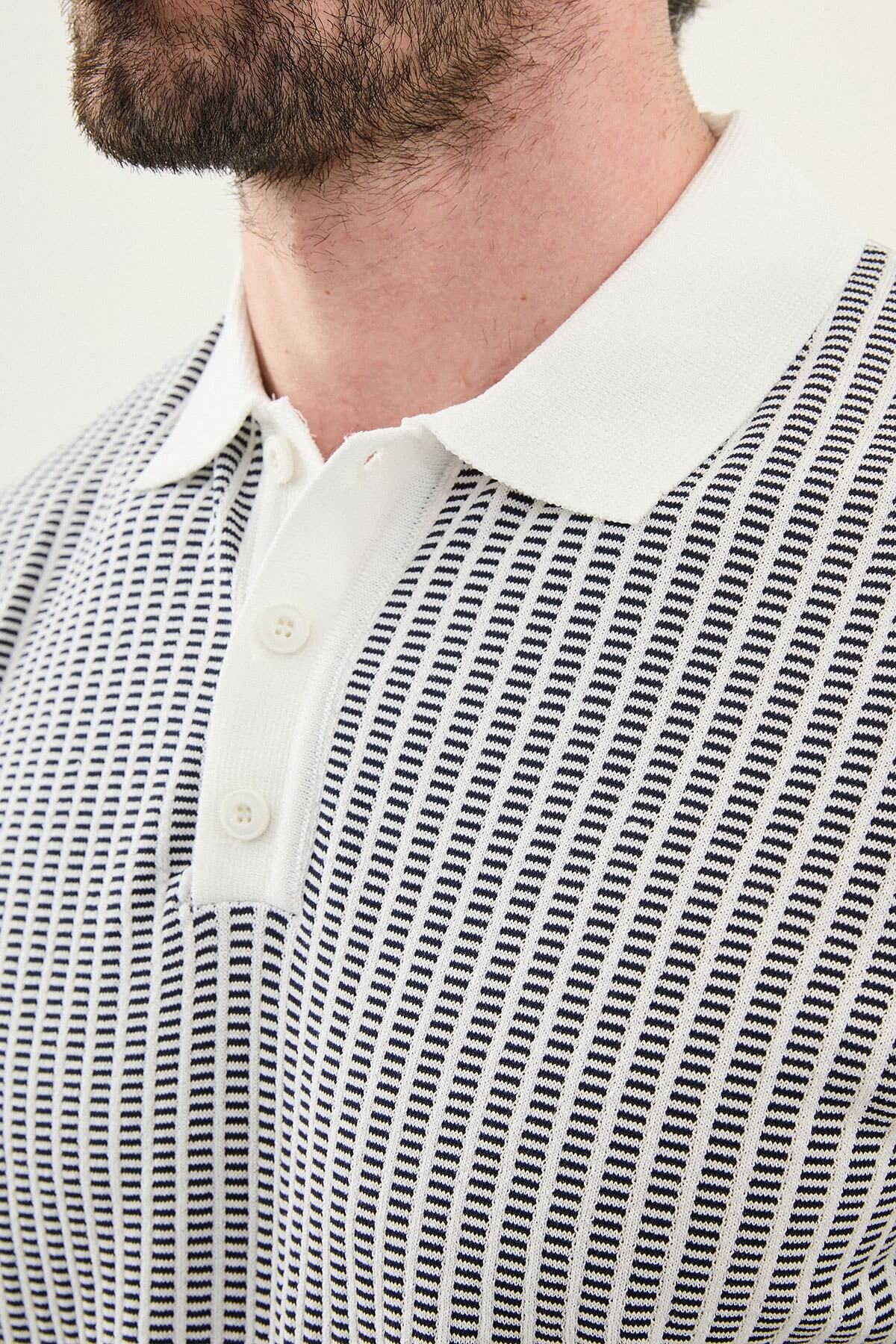 Men’s white striped slim fit knit polo shirt with short sleeves, styled for a refined summer smart-casual outfit.