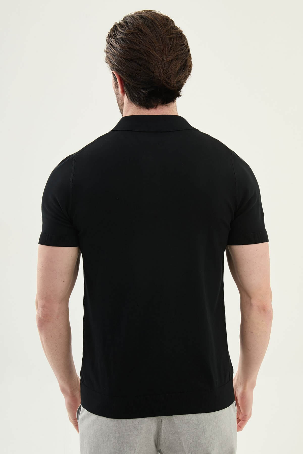 Men’s black slim fit cotton polo shirt with short sleeves and stretch fabric, minimal everyday casual wear