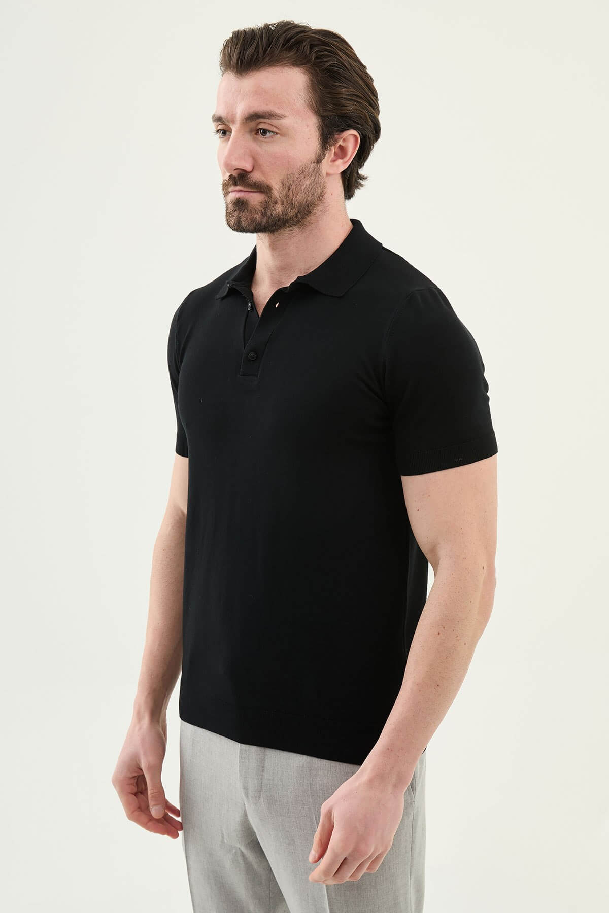 Men’s black slim fit cotton polo shirt with short sleeves and stretch fabric, minimal everyday casual wear