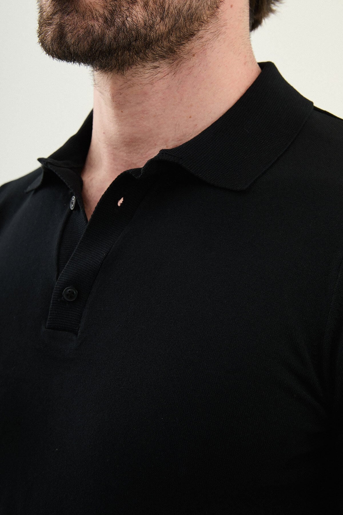 Men’s black slim fit cotton polo shirt with short sleeves and stretch fabric, minimal everyday casual wear