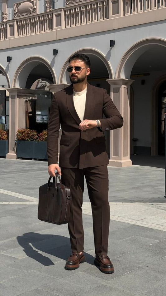 Men’s brown slim fit tailored suit with modern structure, styled with loafers and minimal outfit