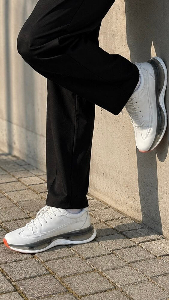 Men's white leather sneaker heel and profile detail view